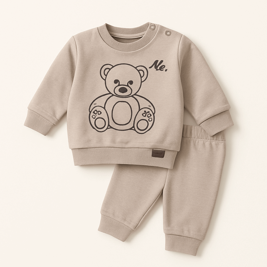 Beige baby sweatshirt and pajama set with a cute teddy bear print, perfect for winter.


