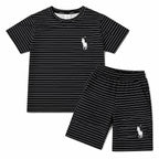 Black boys' summer polo coord set by lilcubspk for ages 12 months to 10 years, featuring a black polo shirt and matching shorts.