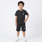 Black boys' summer polo coord set by lilcubspk for ages 12 months to 10 years, featuring a black polo shirt and matching shorts.