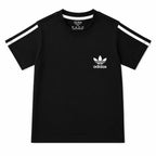Boy wearing black Adidas summer coord set for boys aged 1 to 12 years, featuring a matching top and shorts.