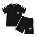Boy wearing black Adidas summer coordinate set for boys aged 1 to 12, featuring a comfortable matching top and shorts.