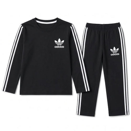 Boy wearing black Adidas summer two-piece coord set for ages 1 to 12, featuring lightweight fabric and sporty style.