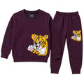 Boy wearing Lil' Cubs purple tiger winter two-piece coord set, featuring a cozy jacket and matching pants for ages 1 to 12 years.