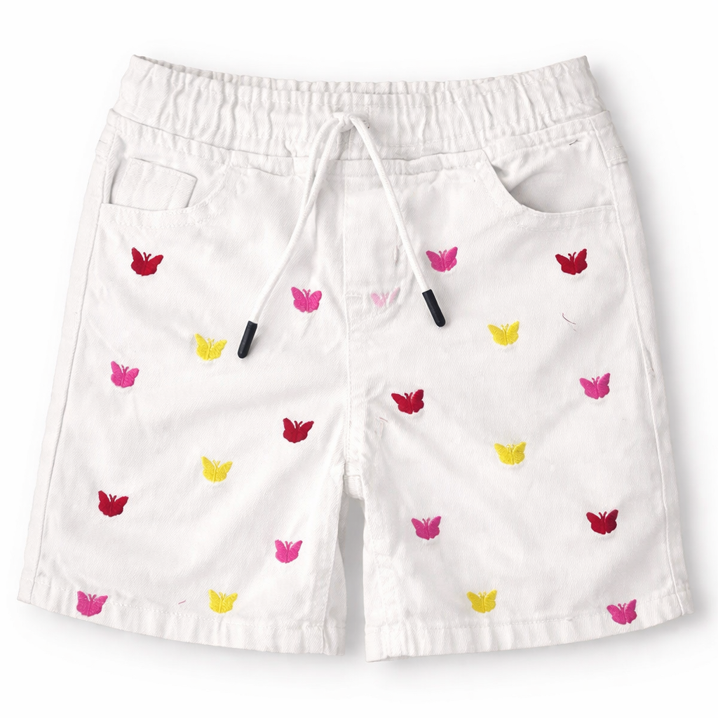 Girls white denim shorts with butterfly embroidery by lilcubspk, suitable for ages 6 months to 5 years, close-up of floral design.
