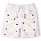 Girls white denim shorts with butterfly embroidery by lilcubspk, suitable for ages 6 months to 5 years, close-up of floral design.