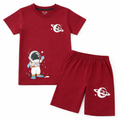 Boy wearing a Lilcubspk summer coord set with astronaut print, short-sleeve top and shorts for ages 1-12.