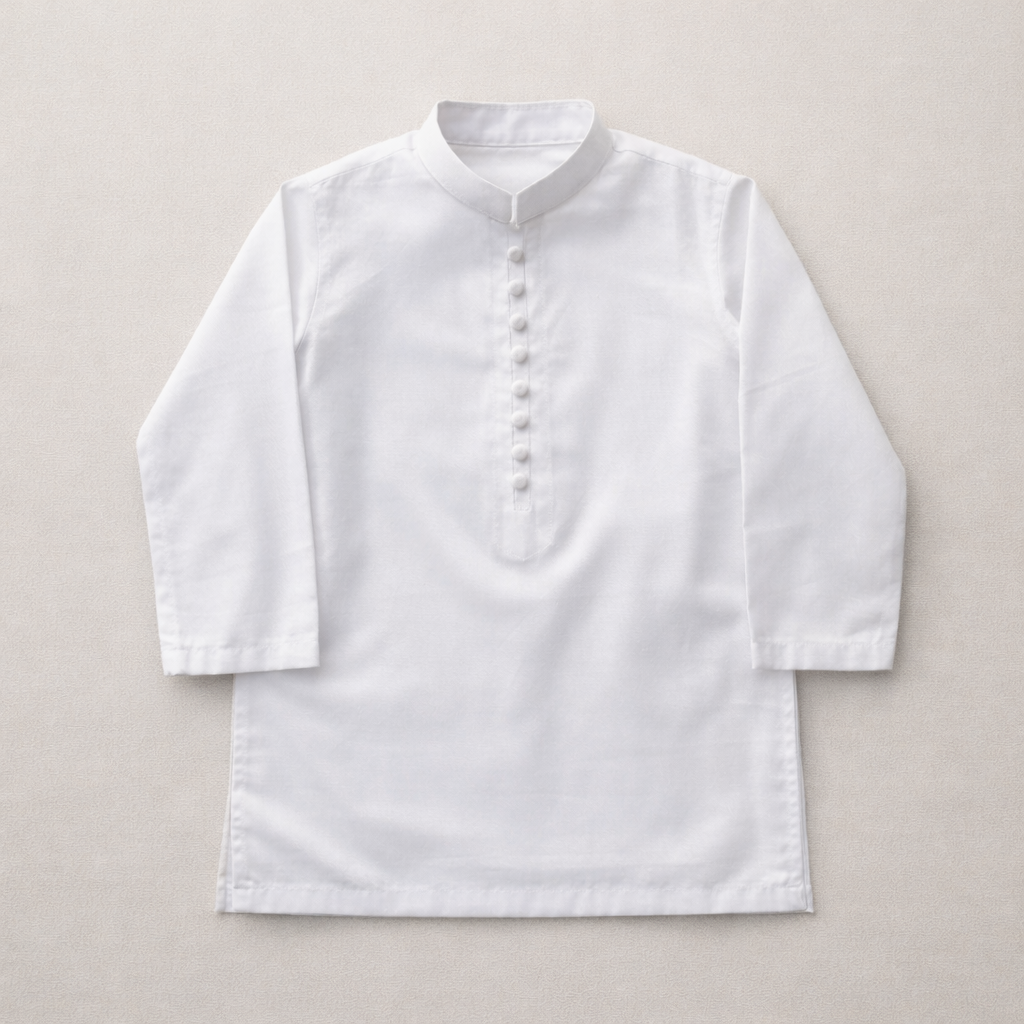 Boy wearing a white cotton prince coat shalwar kameez, three-piece traditional outfit by lilcubspk, with detailed embroidery and matching accessories.