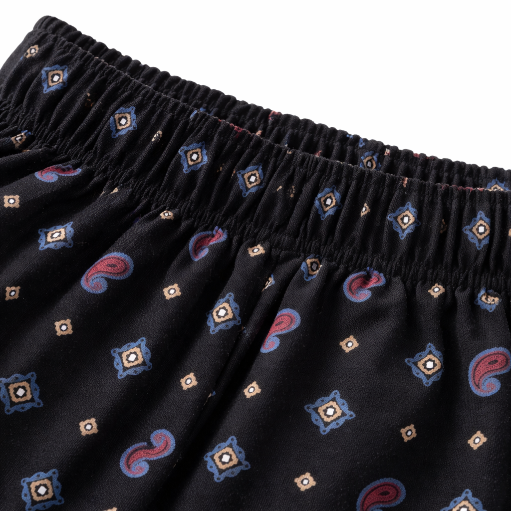 Girls' black cotton pajama trousers with paisley charm pattern from lilcubspk, featuring a comfortable and stylish design.