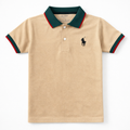 Boys skin-colored polo t-shirt by lilcubspk featuring green and red lining details on collar and sleeves.