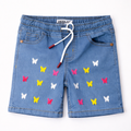 Girls ice blue denim shorts by lilcubspk with butterfly embroidery, featuring a casual fit and decorative stitched details.