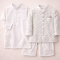 Boy wearing white cotton shalwar kameez with a prince coat, traditional three-piece outfit for boys by lilcubspk.