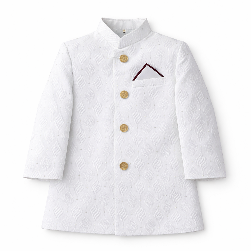Boy wearing a white prince coat with a matching two-piece set from lilcubspk, featuring decorative buttons and a stylish collar.