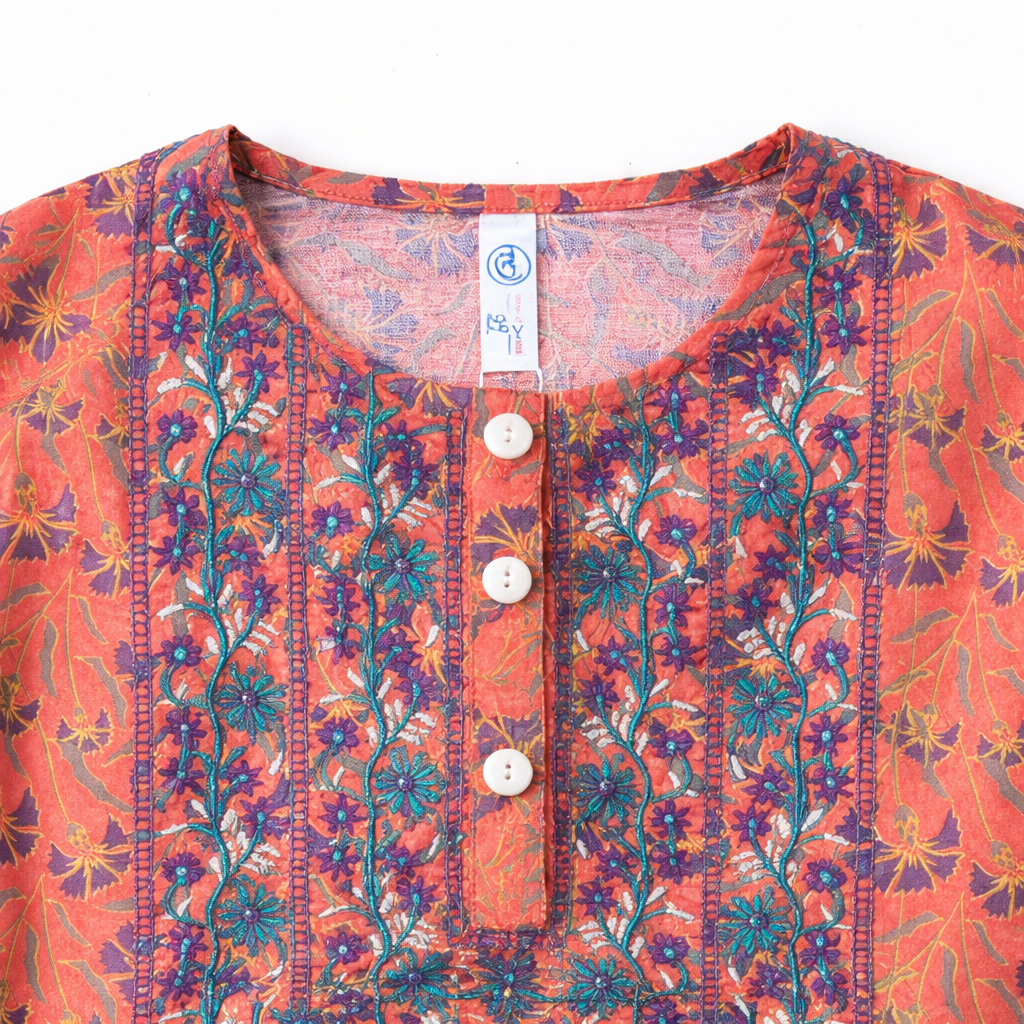 Orange floral print kurti pajama set for girls, two-piece outfit with vibrant floral design from lilcubspk.