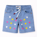 Girls light blue denim shorts with butterfly embroidery by lilcubspk, featuring a casual fit and decorative butterfly details.