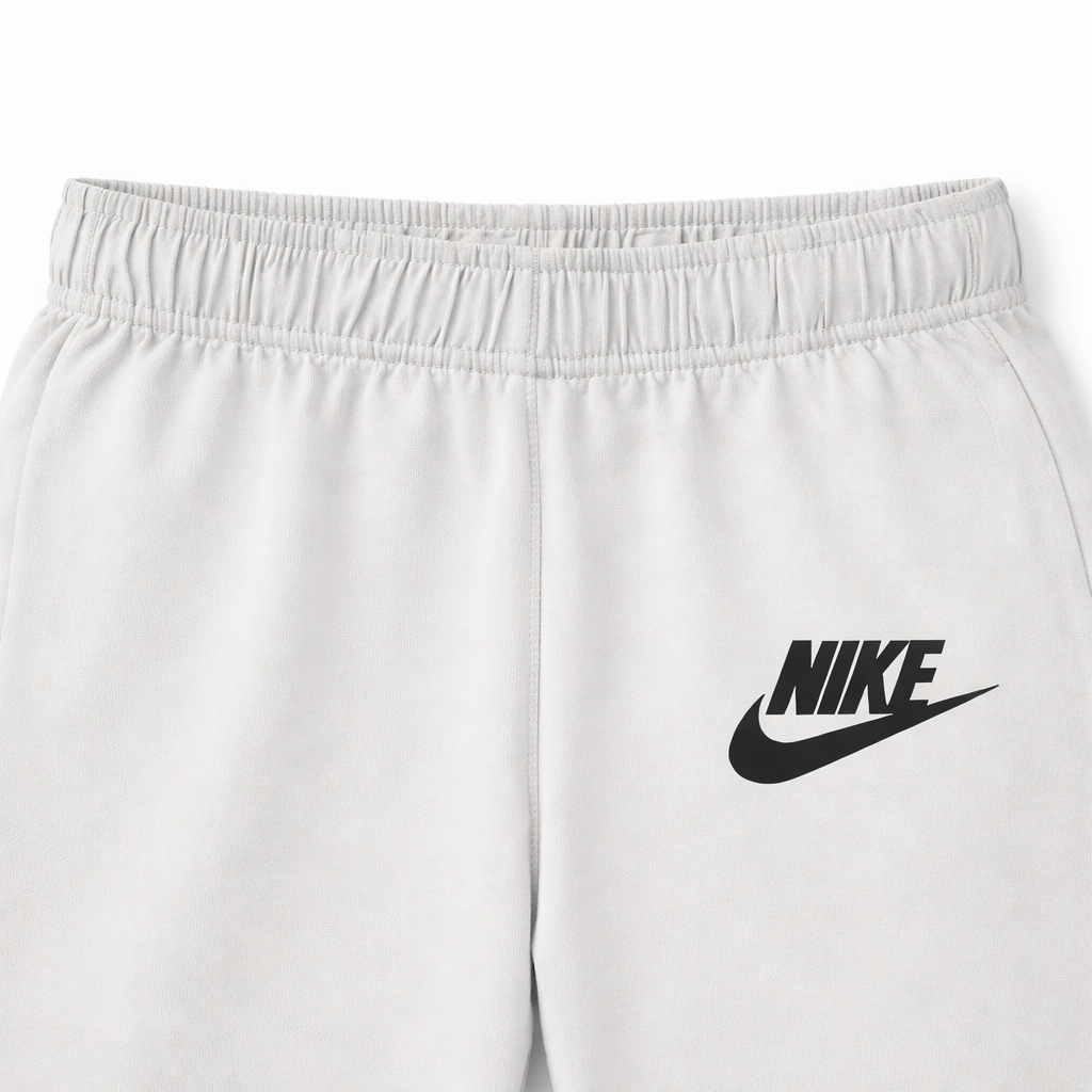Set of three boys' cotton Nike basic trousers by lilcubspk, shown in a neutral color and comfortable fit.