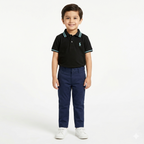 Black boys' polo shirt by lilcubspk with sky blue lining, shown on a young boy, featuring a classic collar and short sleeves.