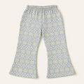 “Geo‑print flare pants in grey with blue and yellow accents, elastic waistband, laid flat.”
