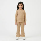 Girls beige imported rib trousers for ages 3 to 12, styled with comfortable rib fabric and a relaxed fit, from Lil' Cubs.
