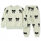 Girls light green bow winter coord set by Lil' Cubs, 2-piece outfit for ages 1 to 12, featuring a cute bow detail and warm fabric.