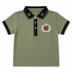 Imported Lil' Cubs boys sea green H polo T-shirt for ages 1 to 5 years, shown on a child with short sleeves and collar.