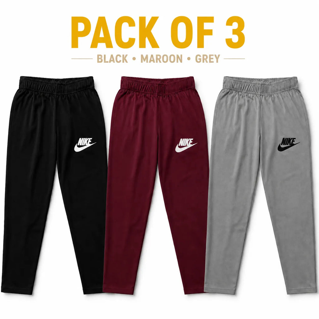 Set of three boys' cotton Nike basic trousers by lilcubspk, shown in navy, grey, and black with elastic waistbands.