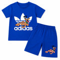 Boy wearing Lilcubs royal blue Pluto summer coord set, 2-piece outfit for ages 1-12, featuring playful Pluto design.