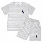 White boys' summer polo coord set by LilCubsPK, includes a white polo shirt and matching shorts for ages 12 months to 10 years.