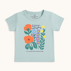 Girls sage green cotton t-shirt with believe everyday floral print – casual summer wear for ages 1 to 12 – flat lay
